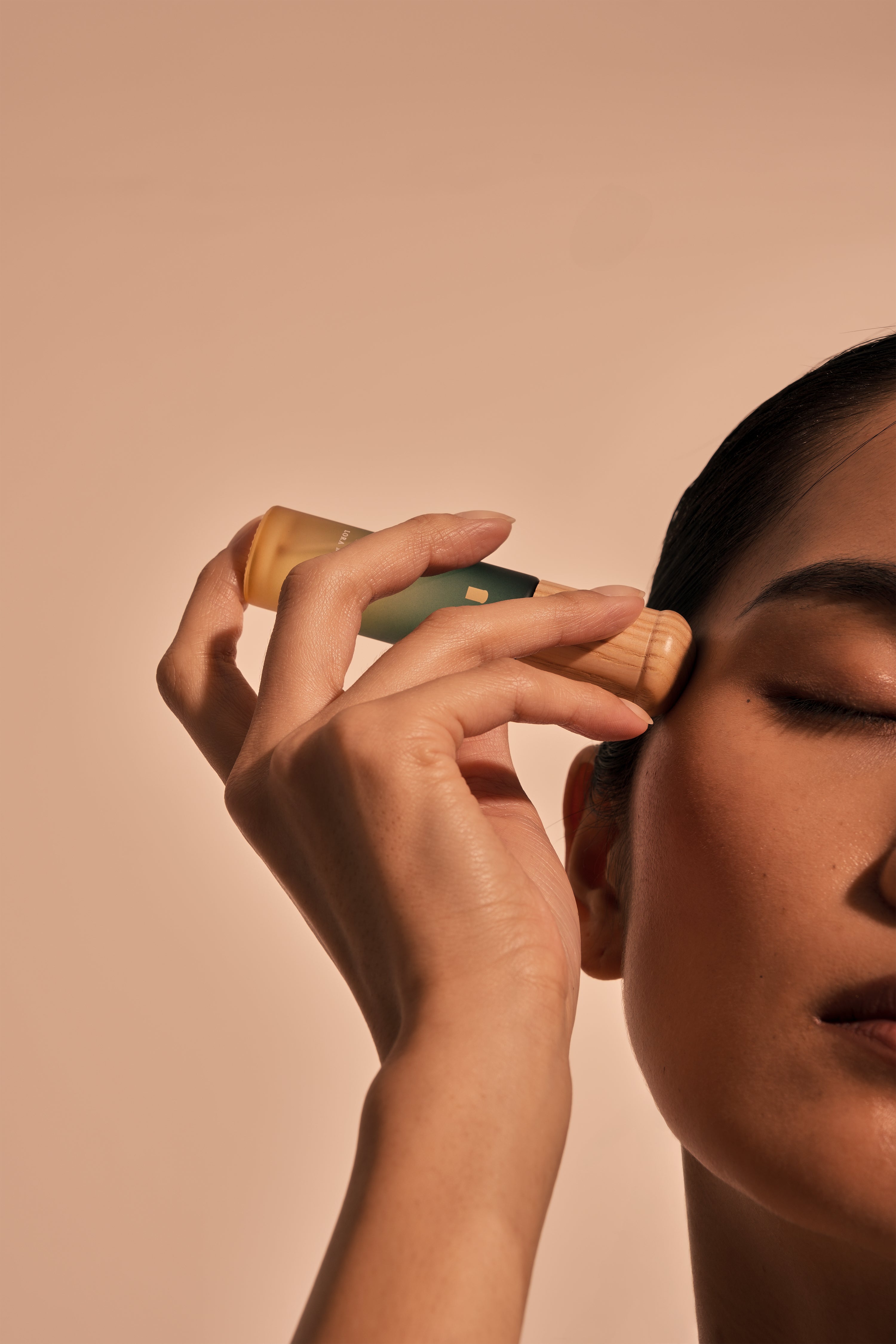Temples — woodcap gently pressed on temples for headache relief