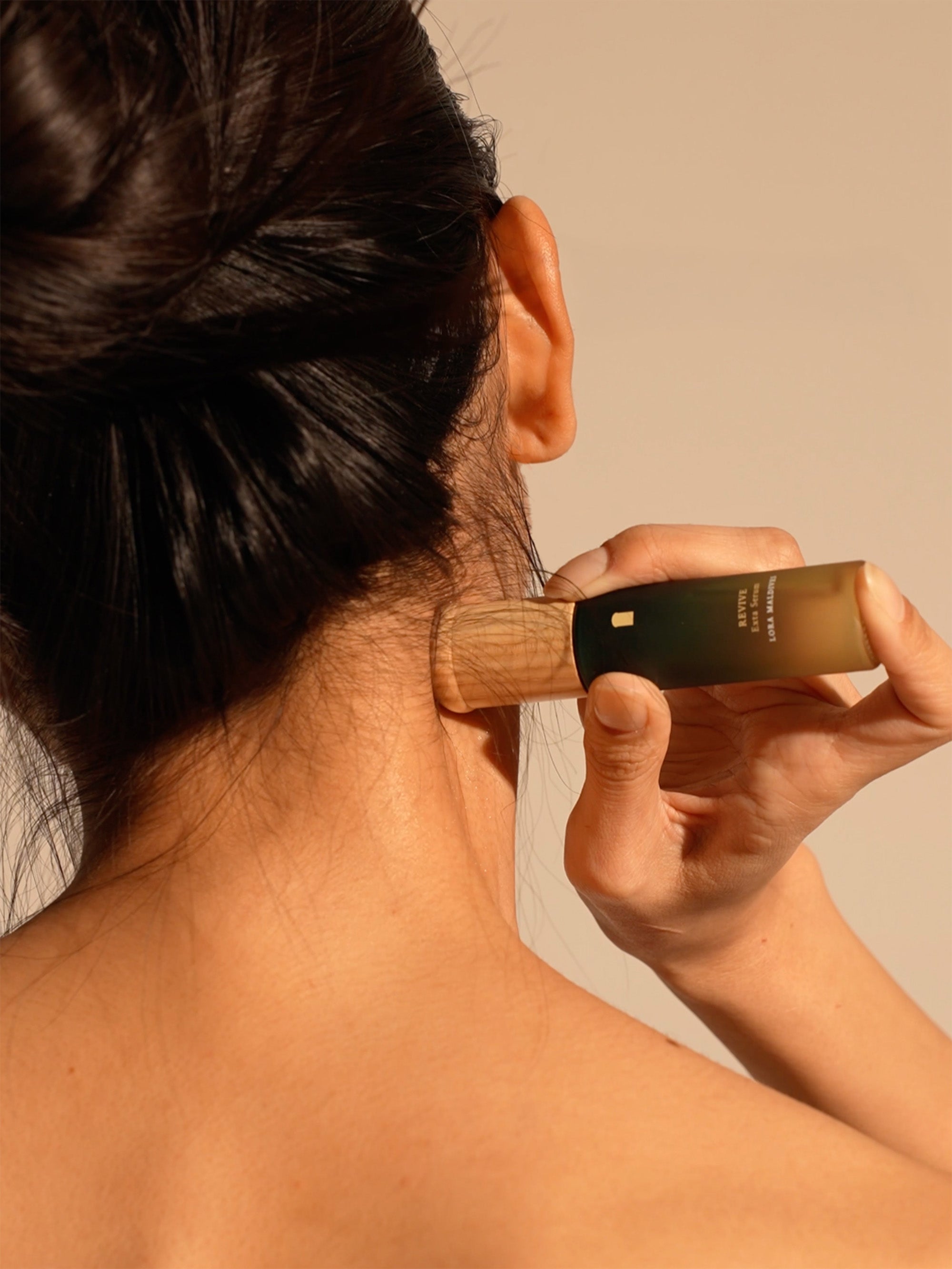 Step 3: Massage — woodcap massaging along the neck line, relaxed expression, eyes closed