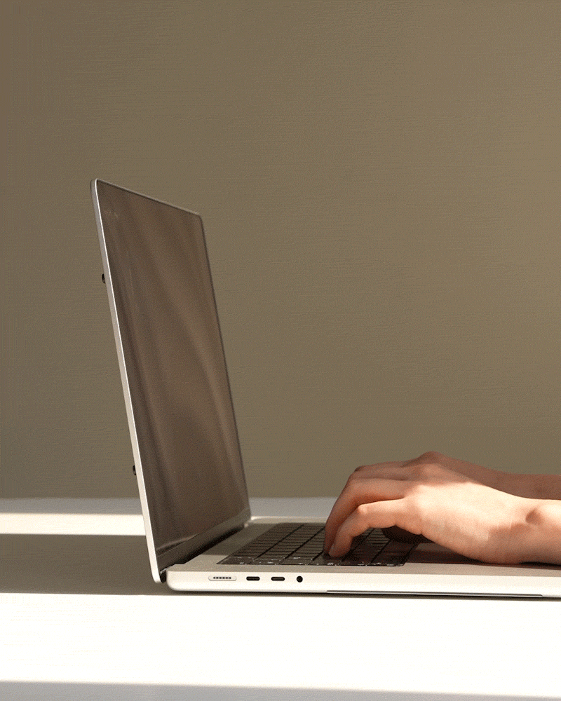 Office worker at monitor, forward head posture — neck and shoulder pain point
