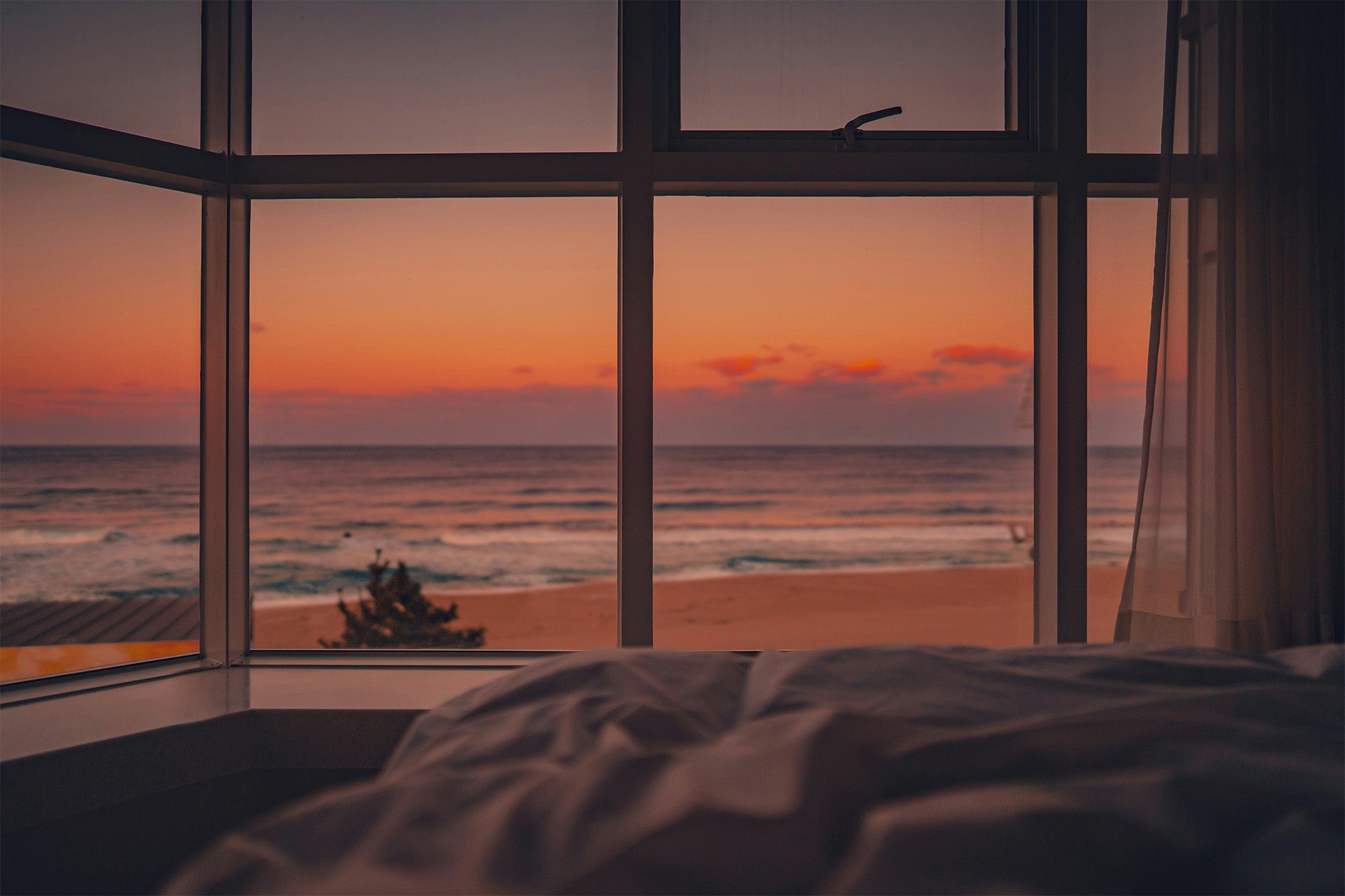 Before bed — nightstand with Revive Exta Serum, gentle neck massage before sleep, warm bedroom light