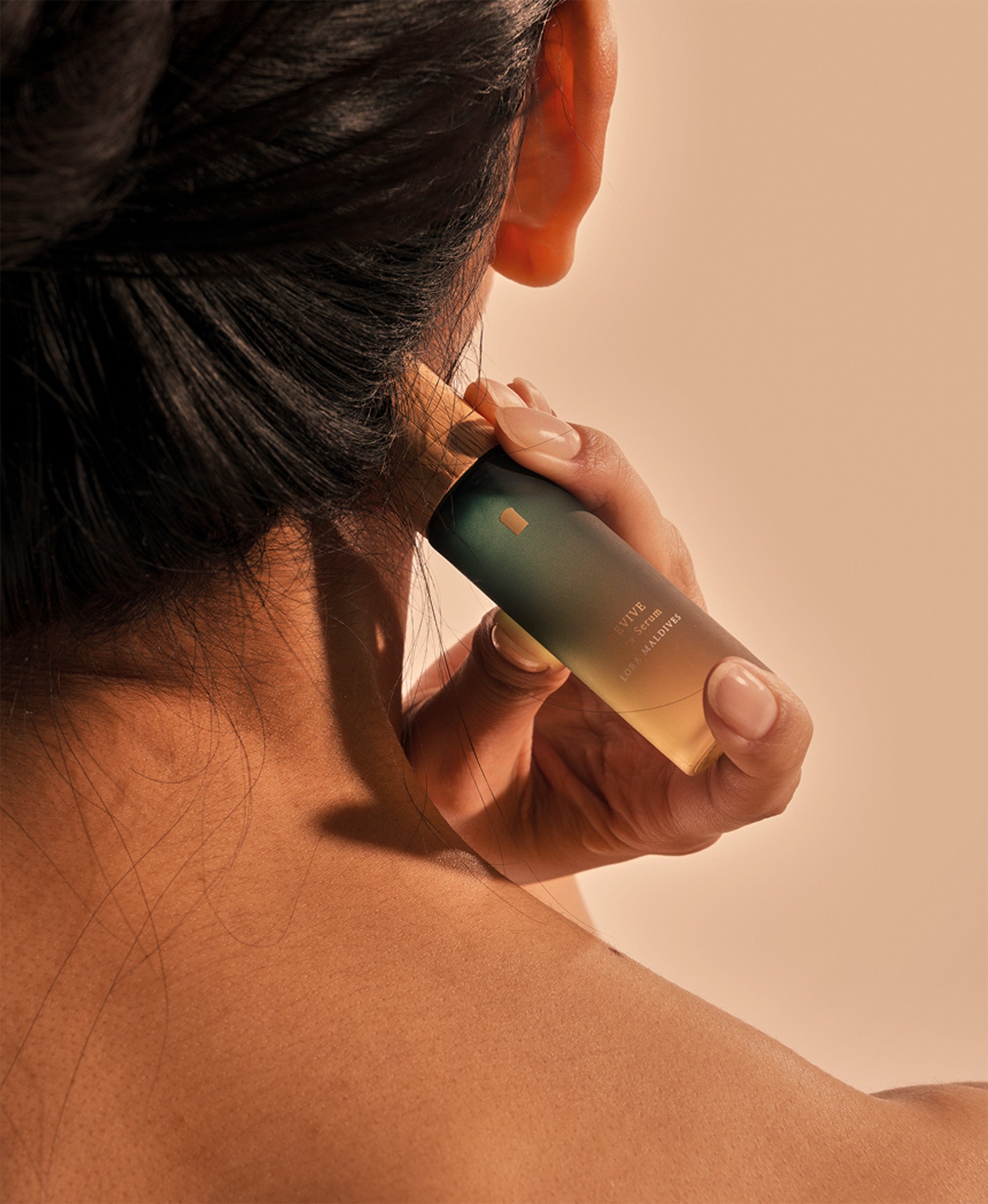 Side profile lifestyle shot — using woodcap massager on neck, natural and relaxed, everyday moment