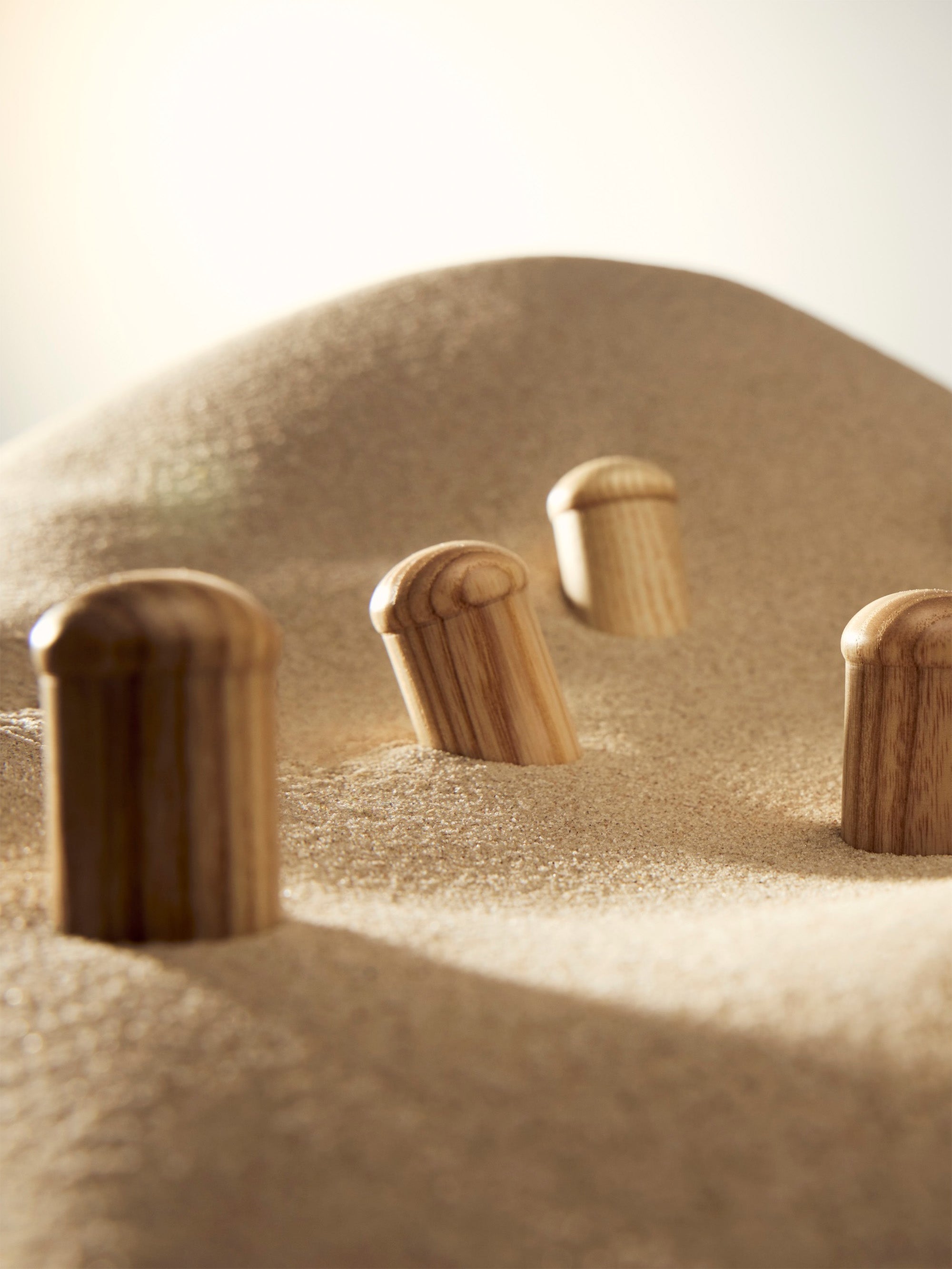 Signature woodcap close-up — natural premium ash wood grain texture, unique pattern